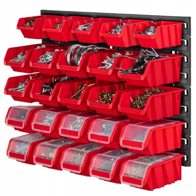 A wall-mounted storage system with multiple red bins filled with various hardware items.