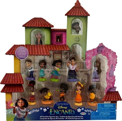 A set of Disney Encanto figurines displayed in their packaging, which is designed to resemble the Madrigal house.