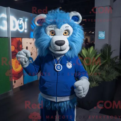 Produktbild von Blauer REDBROKOLY Löwe Maskottchen Kostüm Charakter bekleidet mit einer Strickjacke und Smartwatches
