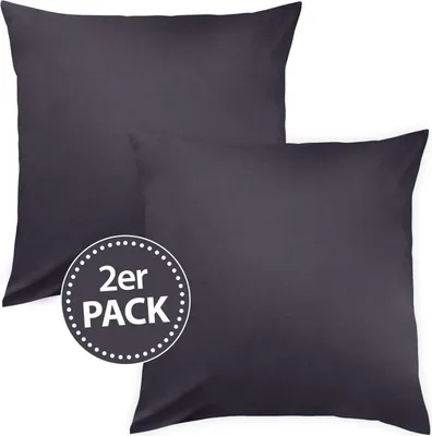Two dark grey pillowcases are shown, one slightly behind the other, with a circular graphic overlay.