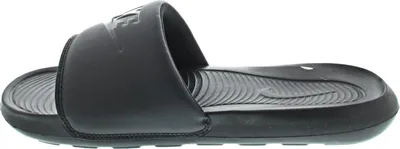 A side view of a black Nike slide sandal.