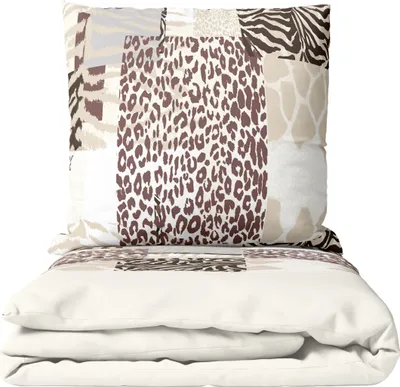 A folded duvet and pillow with a patchwork animal print design.