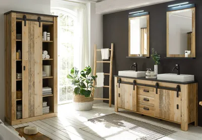 A modern bathroom with a rustic-themed vanity, storage cabinet, and accessories.