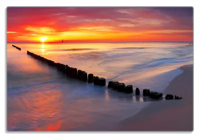 Produktbild von Wallario Frühstücksbrettchen aus Glas 20 x 30 cm mit rutschfesten Füßen, Motiv Farbenspiel im Himmel - Sonnenuntergang am Strand