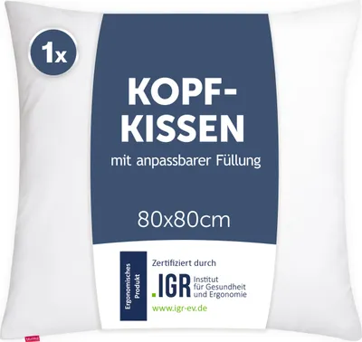 A white pillow with a blue label attached.
