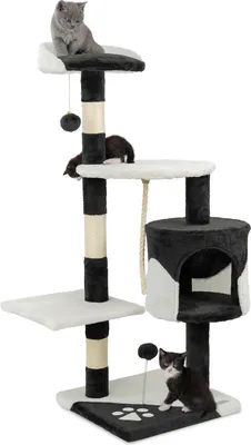 A cat tree with multiple levels and scratching posts, featuring three cats interacting with it.