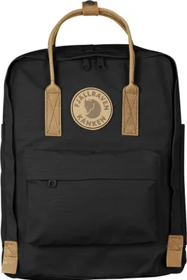 A black Fjällräven Kånken backpack with tan leather accents.