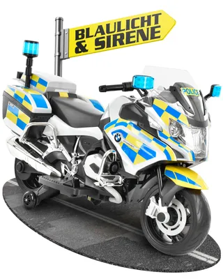 A toy police motorcycle with a sign.