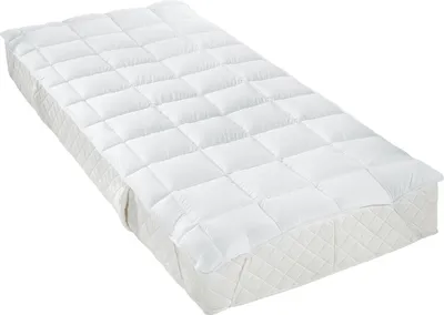 A white mattress topper is shown on a white background.
