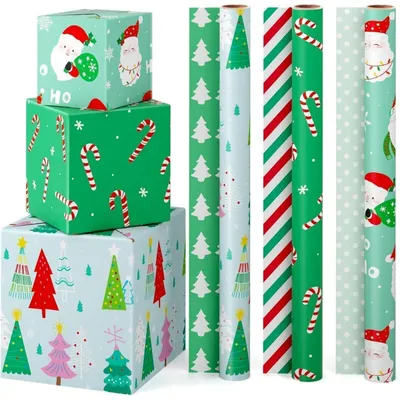 Obrázek produktu pro Dekorační papír na Vánoce, 3 role. Vhodné pro děti, motiv: Santa Claus, cukrové tyčinky, vánoční stromečky. Rozměry: 43 cm x 3 m