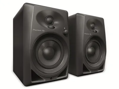 A pair of black Pioneer DJ monitor speakers are shown against a white background.