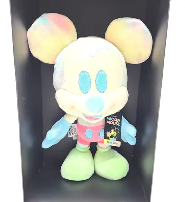A tie-dye Mickey Mouse plush toy is displayed in a black box.