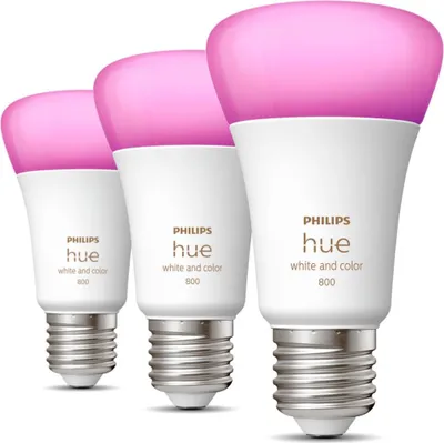 Three Philips Hue light bulbs are arranged in a row against a white background.