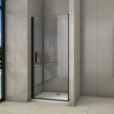 A modern shower enclosure with a black frame and clear glass, set against tiled walls and floor.