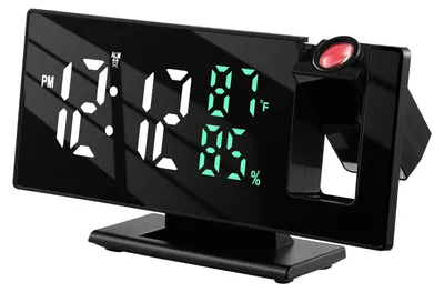 A black digital alarm clock with a projection feature is shown against a black background.