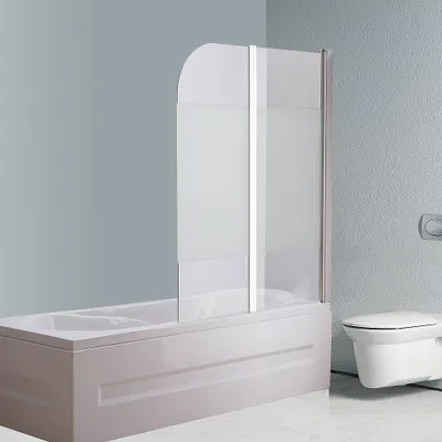A bathroom scene showing a bathtub with a shower screen and a toilet.