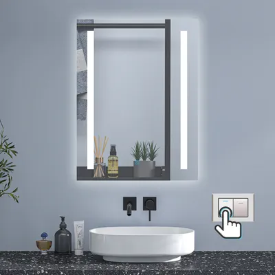 A modern bathroom vanity with a lit mirror, sink, and faucet.