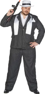 A man wearing a gangster costume, holding a toy gun.