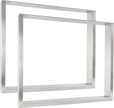 Two silver metal table legs or frames