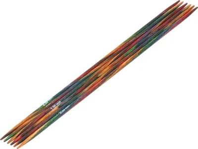 A set of knitting needles arranged diagonally on a white background.