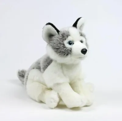 A plush toy husky dog sitting on a white background.