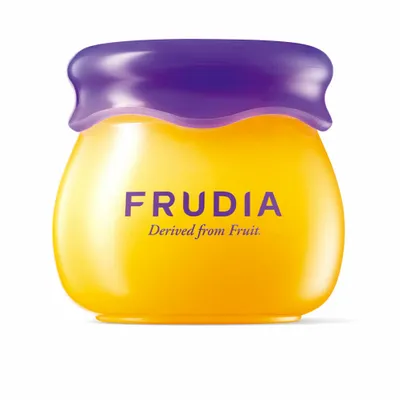 A product shot of a yellow jar with a purple lid, featuring the brand name FRUDIA and the tagline 'Derived from Fruit'.