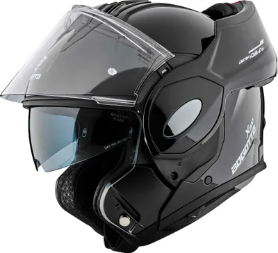 A black motorcycle helmet with the visor up and the sun visor down, shown against a white background.