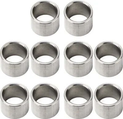 A group of metal washers or spacers arranged in rows on a white background.