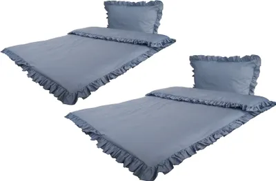 Two sets of blue bedding with ruffled edges are displayed against a white background.
