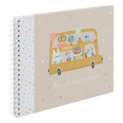 A spiral-bound photo album with a cover illustration of cartoon animals on a school bus.