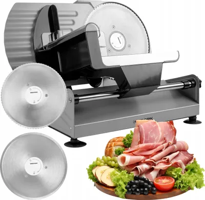 A meat slicer with two interchangeable blades, presented with a platter of sliced meats and accompaniments.