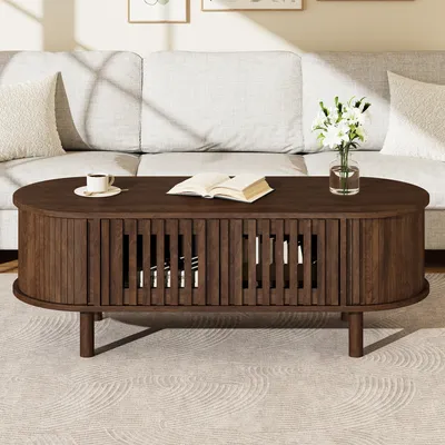 Image de Table basse ovale Merax avec porte coulissante à stores, table d'appoint pour canapé avec 2 portes à lamelles et pieds en bois massif, table de salon en MDF avec espace de rangement, finition noyer