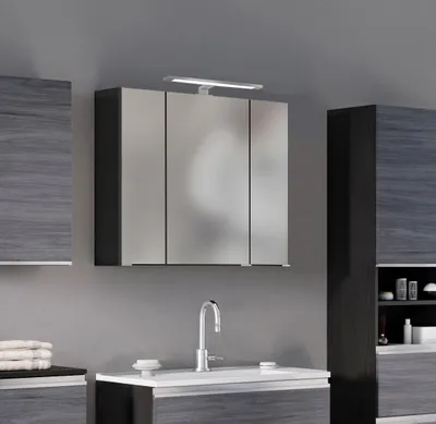 A modern bathroom vanity with a mirrored cabinet and sink.