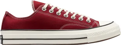 A side view of a single red Converse Chuck 70 sneaker against a white background.