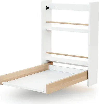 A white wall-mounted changing table with wooden accents, shown in an open position.