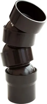 A stack of dark brown PVC pipe connectors with ball joints, arranged in a curved formation.