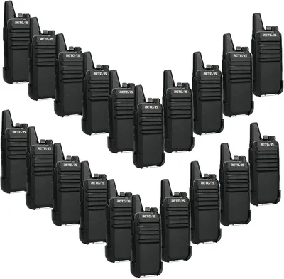A collection of black walkie-talkies arranged in a V-shape.