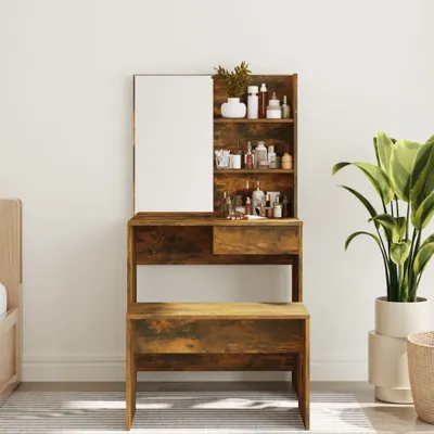 A dressing table with a mirror and shelves filled with cosmetic products, placed next to a large potted plant.