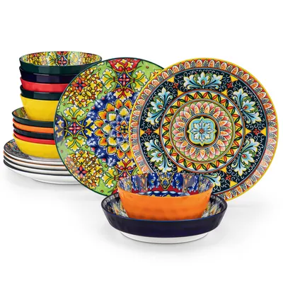 A set of colorful, patterned ceramic plates and bowls arranged in a visually appealing display.