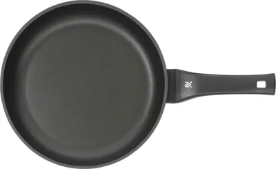 A top-down view of a black frying pan with a black handle against a white background.