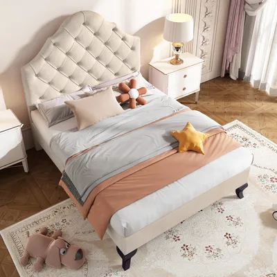 A bedroom scene with a bed, nightstand, and rug.
