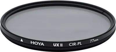 A circular camera lens filter with text printed on its rim.