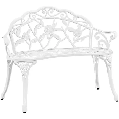 A white metal garden bench with a rose pattern.