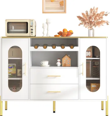 A white sideboard with gold accents, featuring glass doors, a wine rack, and drawers, displayed in a room setting.