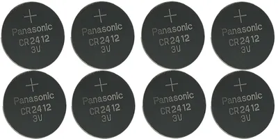 Eight round, flat lithium coin cell batteries are arranged in two rows of four.