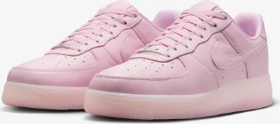 A pair of pink Nike Air Force 1 sneakers.
