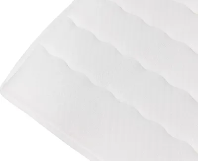 A close-up view of a white quilted mattress topper.