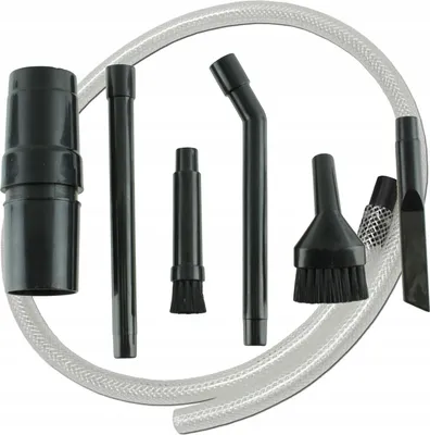 A collection of vacuum cleaner attachments and a hose are arranged on a white background.