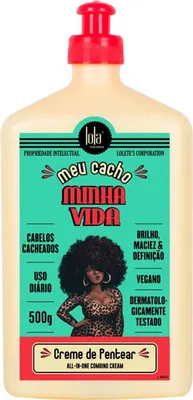 A product shot of a hair cream bottle with a woman's illustration on the label.