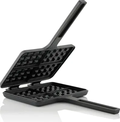 An open cast iron waffle maker with a black finish, shown against a white background.